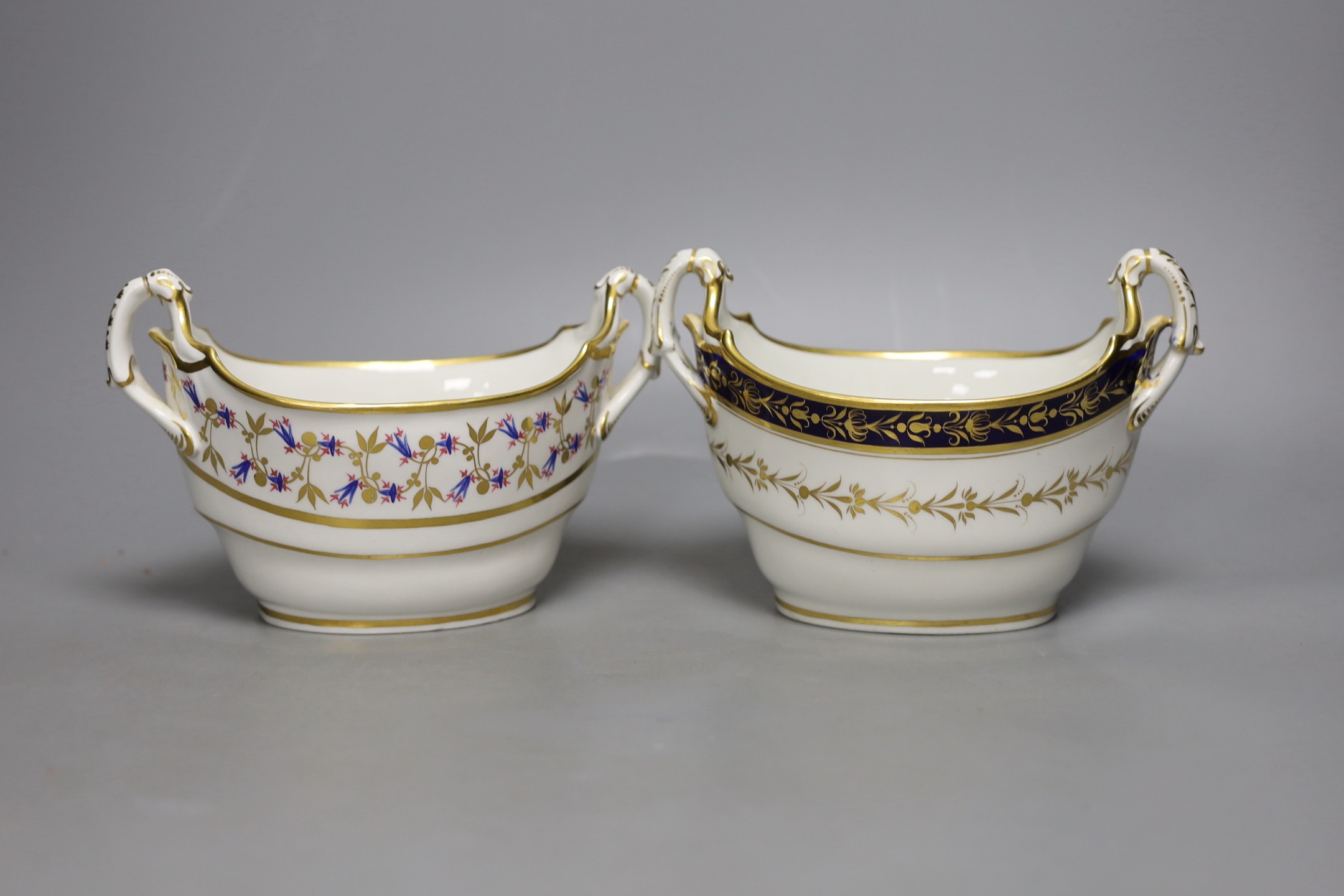 A Barr Flight Barr boat shaped two handled sucrier painted with stylised cornflowers and a similar sucrier with blue and gilt decoration c. 1810, 19 cms wide